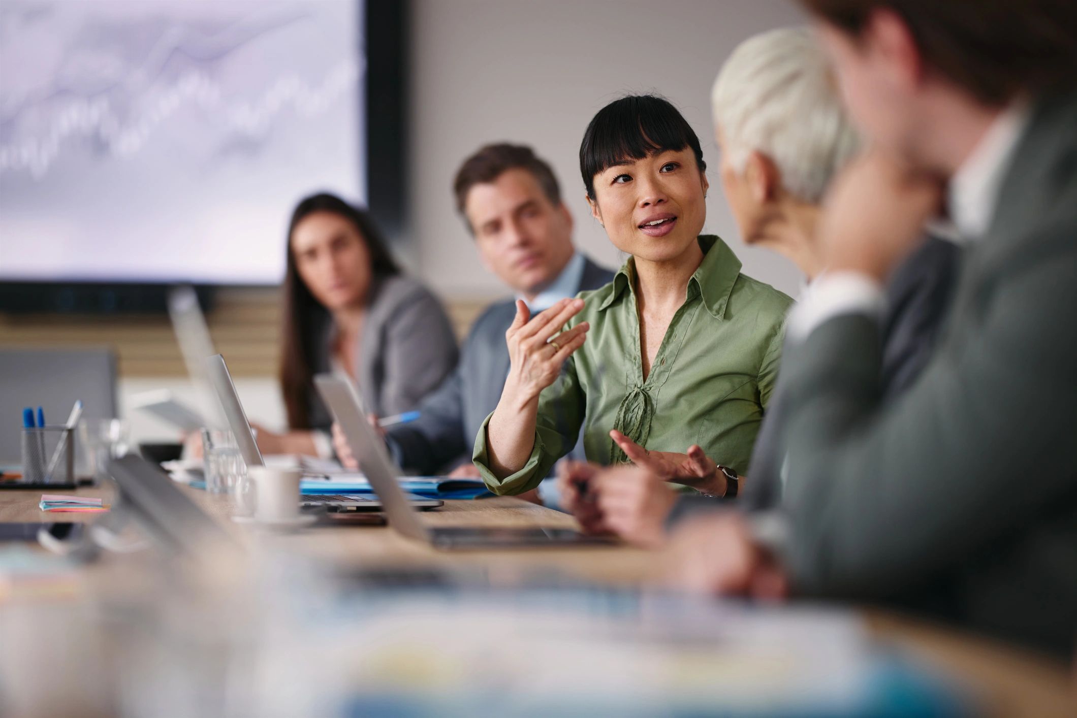 Businesswoman speaking with a colleague in an office